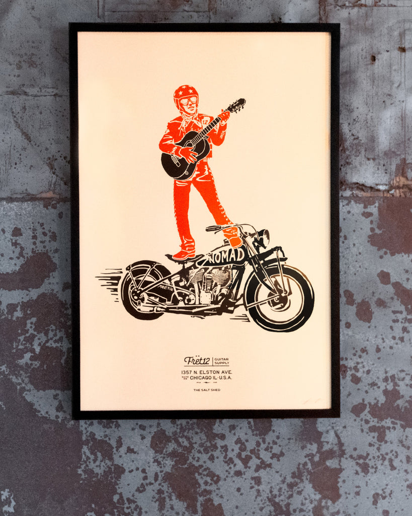 Giclée multicolor art print of the legendary Mariachi Rider, featuring the rider standing on a motorcycle while playing guitar. Printed on archival photo paper with vibrant details, hand-signed by artist Daniel Tremonti, and presented in a solid wood black gallery frame with a non-glare UV-resistant acrylic insert. Proudly made in the USA.