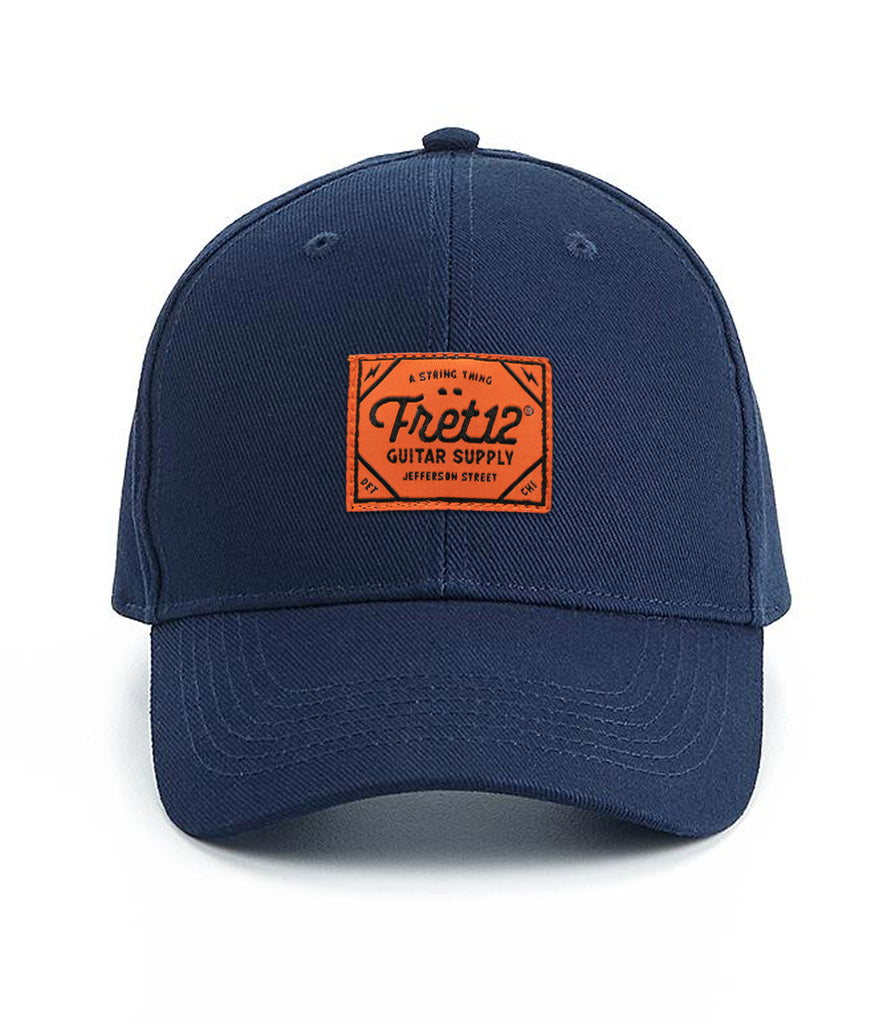 ORANGE BADGE 6 PANEL HAT – NAVY